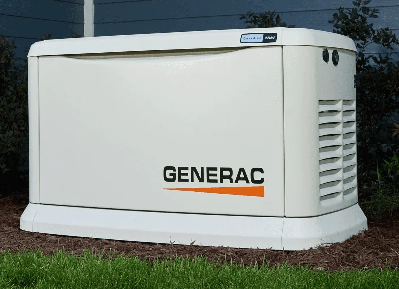 Generac standby generator installed beside a home